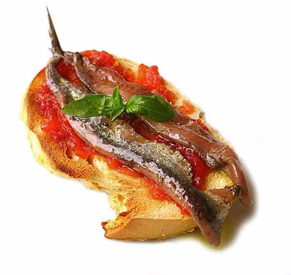 Canapé de "pa amb tomaca" y anchoas de La Escala