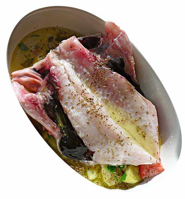 Cabra cruda al entrar al horno (sin cabeza)